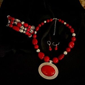 3-piece necklace, bracelet, and earrings set. Silver and red stones.